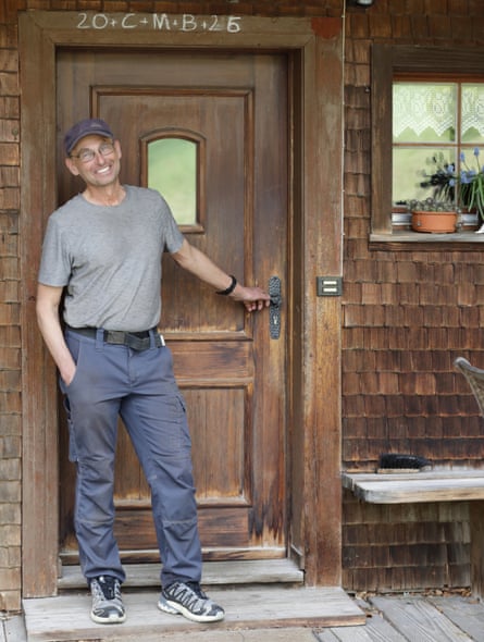 Ewald Lorenz standing in front of an old wooden door