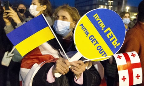 A woman takes part in a demonstration in Tbilisi, Georgia, to protest against Russia’s invasion of Ukraine.