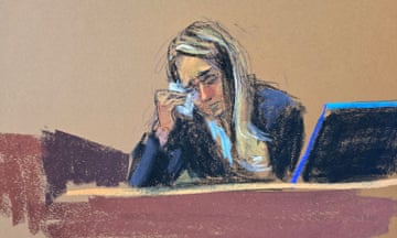 Woman in blue shirt wipes tear from eye in courtroom sketch