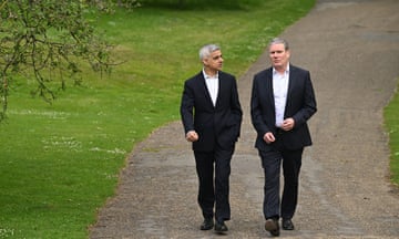 Mayor of London Sadiq Khan and Labour leader Keir Starmer walk together in St. James Park.