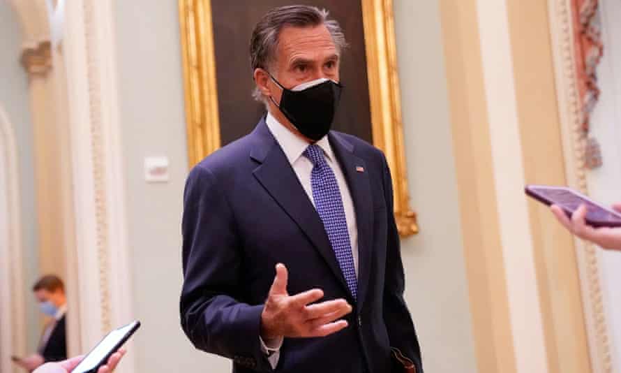 Mitt Romney speaks to reporters at the US Capitol in Washington.