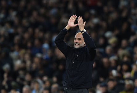 Pep Guardiola applauds from the sidelines