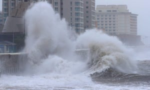 Waves crash into a sea wall during heavy swells from ex-typhoon Kong-Rey, on Jeju island, South Korea