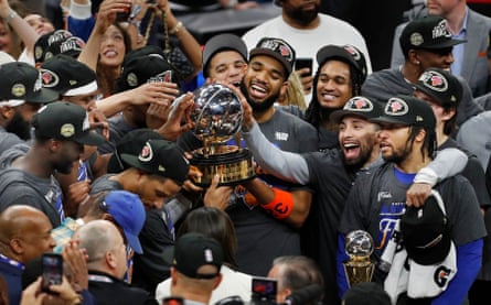 people holding a trophy