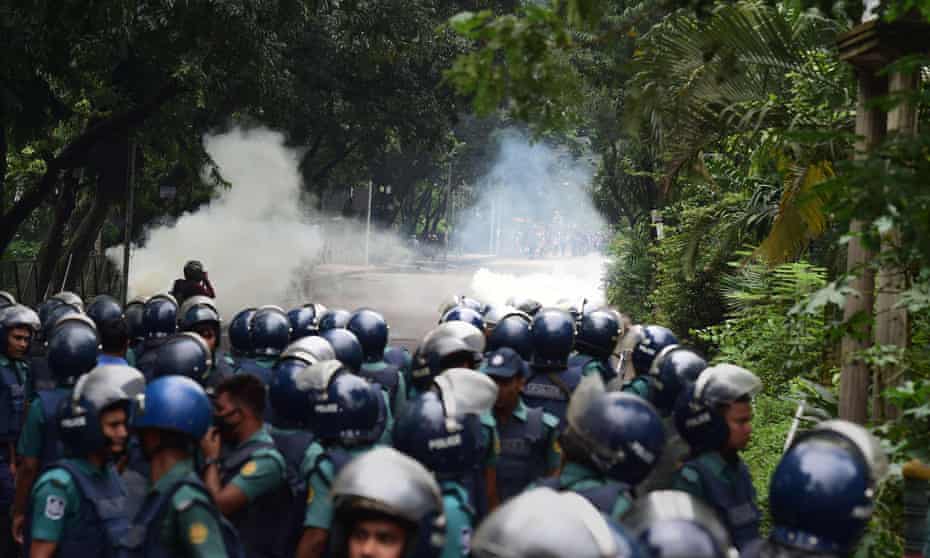 Bangladeshi police clash with students in Dhaka on Sunday. 