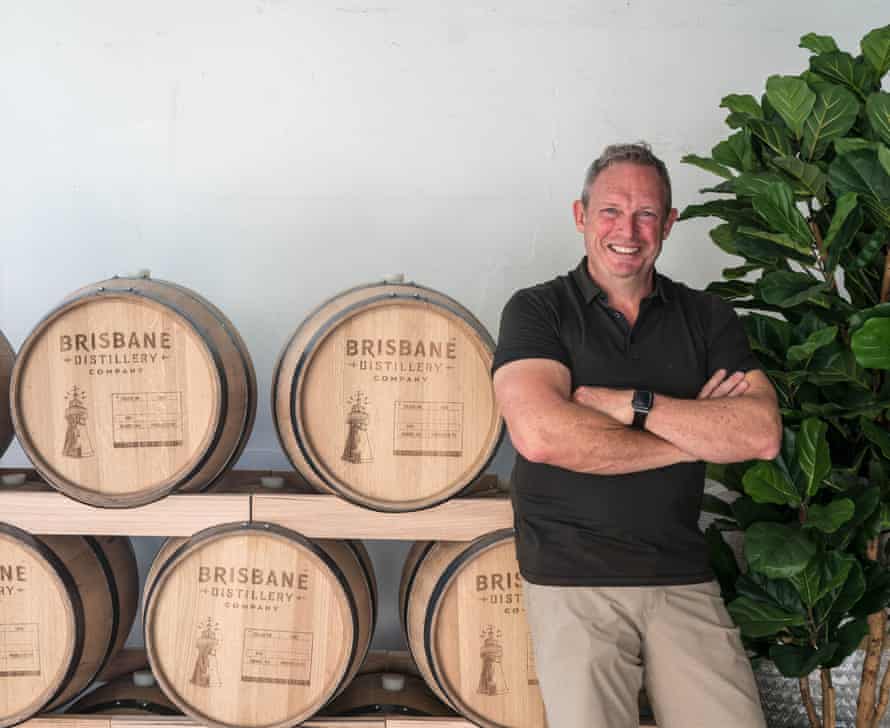 Brisbane Distillery’s Jon Atherton beside his barrels.