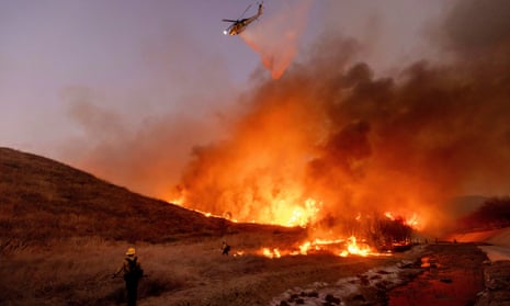 Fire crews battle the Kenneth Fire in the West Hills section of Los Angeles, Thursday, Jan. 9, 2025. (AP Photo/Ethan Swope)