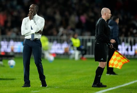 Dwight Yorke smiles on the sidelines as he manages the A-League All Stars to a narrow friendly defeat by Barcelona in May 2022