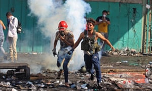 Protesters in Baghdad flee teargas canisters