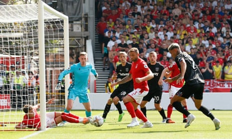 Nottingham Forest scramble the ball clear.