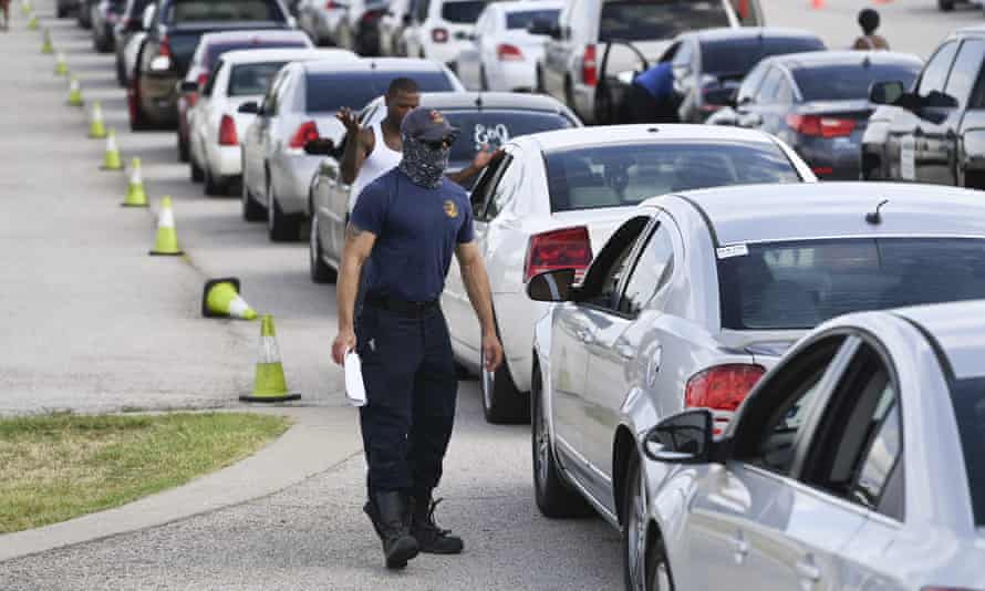 Austin fire officials help east Texans and west Louisiana residents get settled at the Circuit of the Americas race track, after evacuating low-lying areas about to get hit by Hurricane Laura on the Gulf Coast.