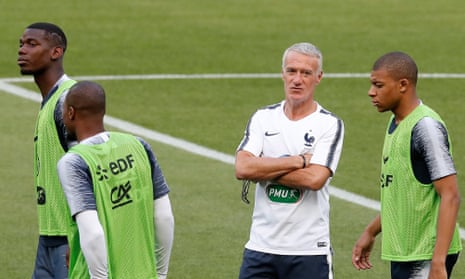 Didier Deschamps chats with Kylian Mbappé at a France training session with Paul Pogba in attendance.