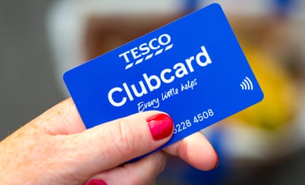 Someone holds a Tesco Clubcard