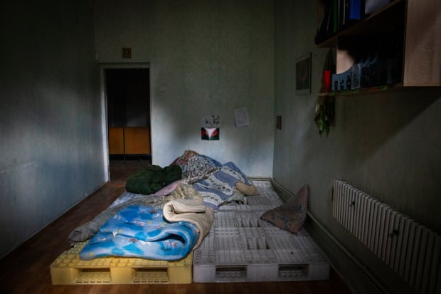 Cushions placed on crates on which Russian troops can sleep can be seen in the rooms of the prosecutor's office in Shevchenkove,