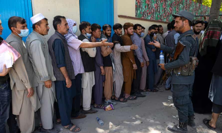 Displaced Afghans in Kabul on 14 August, desperate to have their travel documents confirmed.
