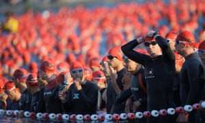 Athletes wait for the start of the swimming section of the Ironman triathlon in Frankfurt, Germany.