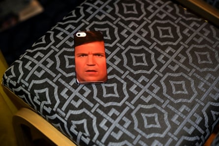 A phone case with a man’s face on it.