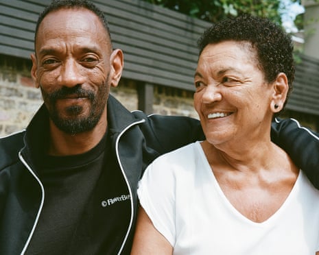 Darcus Beese with his arm around his mother Barbara, who is smiling at him
