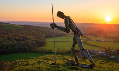 Pilgrim statue on the hilltop at Strata Florida Abbey, Ceredigion at sunset