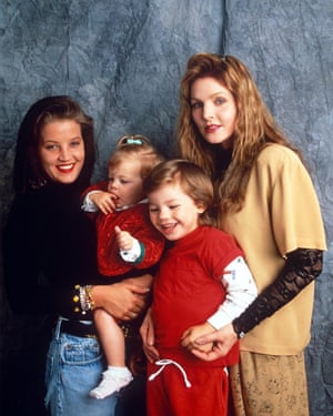 Lisa Marie and Priscilla Presley pose for a photo with Lisa Marie's daughter Riley and Priscilla's son Navarone Garibaldi