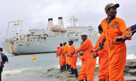 Workers haul part of a fibre optic cable on to the shore at Mombasa, Kenya. ‘Research suggests many African countries are well placed to take advantage of a more open trading environment.’