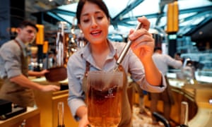 An employee prepares a coffee inside the Starbucks in Milan.
