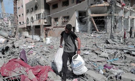 A man collects belongings after overnight Israeli shelling in Gaza City.