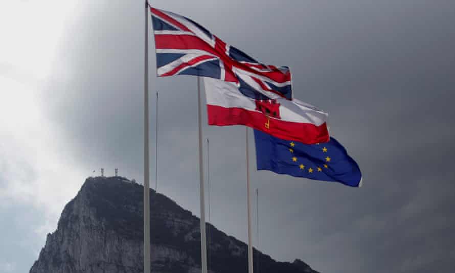 The union, Gibraltarian and EU flags at the border of Gibraltar with Spain.
