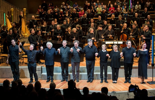 Peter Sellars and Simon Rattle (second and third from left) take the applause with soloists after a performance with the Berliner Philharmoniker.