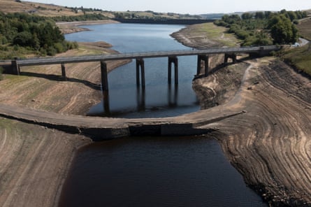 Bridge over dried-out reservoir, with an old, lower bridge exposed