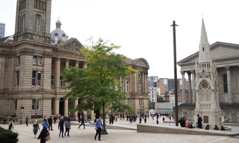 People walking in a square next to Birmingham's Council House