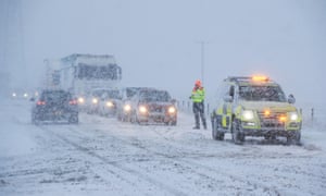 Lorries and cars in the snow on the A6 near the village of Shap in Cumbria.