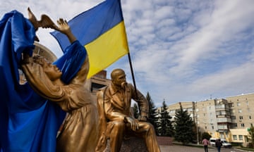 Ukrainian flags on statues in Balakiya, Ukraine, which was under Russian occupation.