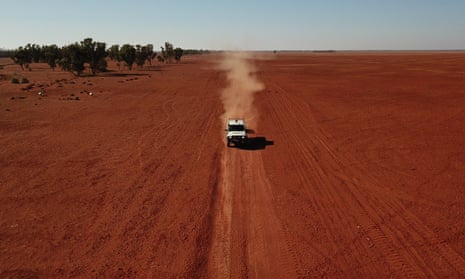 A grazier drives across his drought-affected property.