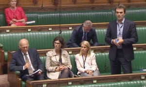 Liberal Democrat MP Tom Brake asking a question in the House of Commons while not wearing a tie.