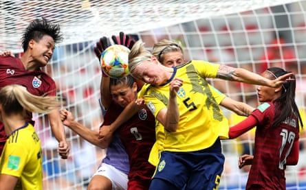 Nilla Fischer of Sweden competes for a header with Waraporn Boonsing and Miranda Nild of Thailand during a group F match between Sweden and Thailand at Stade de Nice.