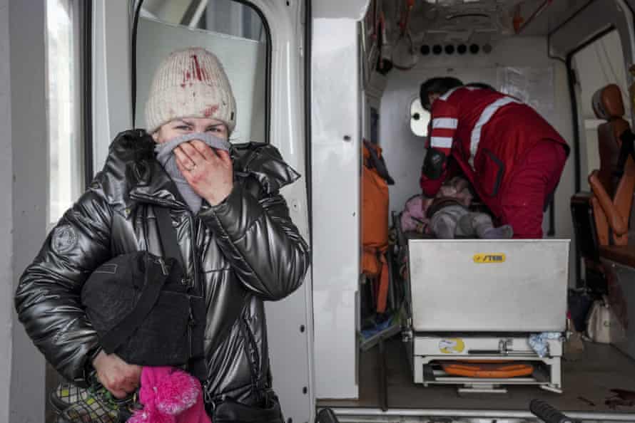 Paramedics perform CPR on a girl injured during shelling in Mariupol on 27 February. The girl did not survive.