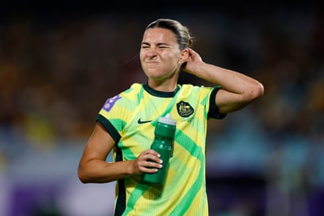 Steph Catley winces after getting up