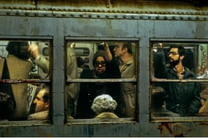 a Willy Spiller photo titled "Being Squeezed, Rush Hour on Lexington IRT, Subway New York, 1977-1985": people seen sitting and standing through the window of a busy subway carriage