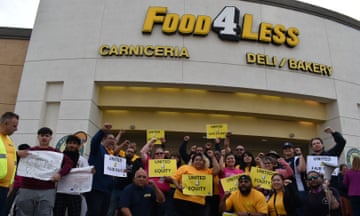 People rally in support of Food 4 Less workers on 16 May.