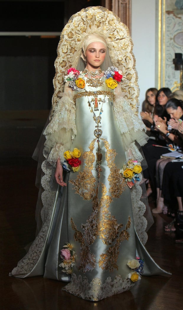 A model wearing an elaborate and ornate silver and gold gown and headdress by French designer Christian Lacroix during 2009/2010 Autumn-Winter Haute Couture collection show on July 7, 2009, in Paris