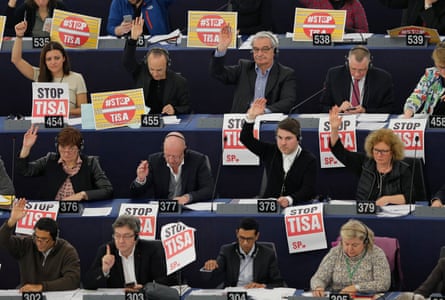 Members of the Confederal Group of the European United Left hold posters with the slogan ‘Stop Tisa’ (Trade in Services Agreement) during a voting session at the European parliament in Strasbourg, France.