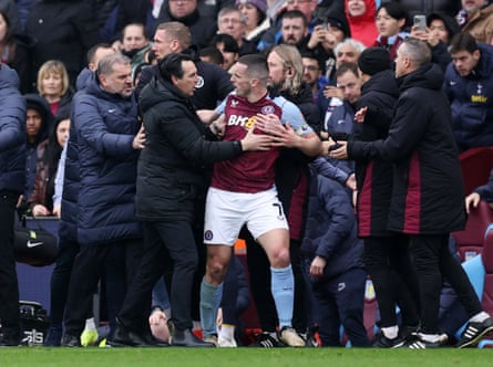 10 March 2024 Aston Villa’s John McGinn argues with Ange Postecoglou before being shown a red card at Villa Park as Tottenham won 4-0.