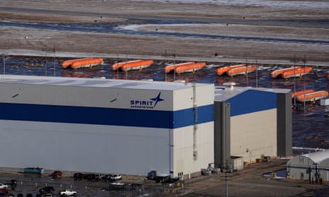 Airplane fuselages bound for Boeing's 737 Max production facility sit in storage behind Spirit AeroSystems headquarters, in Wichita, Kansas, in 2019.