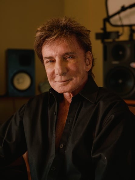Close up of Barry Manilow in a black shirt
