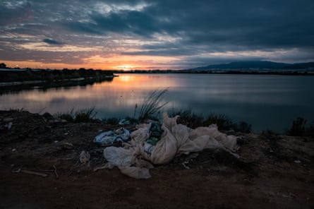 Plastic waste by a lake
