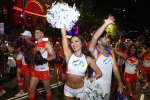 Members of the LA Rams cheerleaders walk in the Sydney Gay and Lesbian Mardi Gras parade