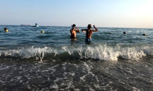 Children in the sea at Santa Maria di Castellabate, Italy