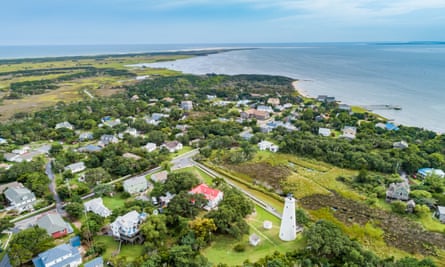 View of Ocracoke lighthouse and shoreline, North Carolina, USA.