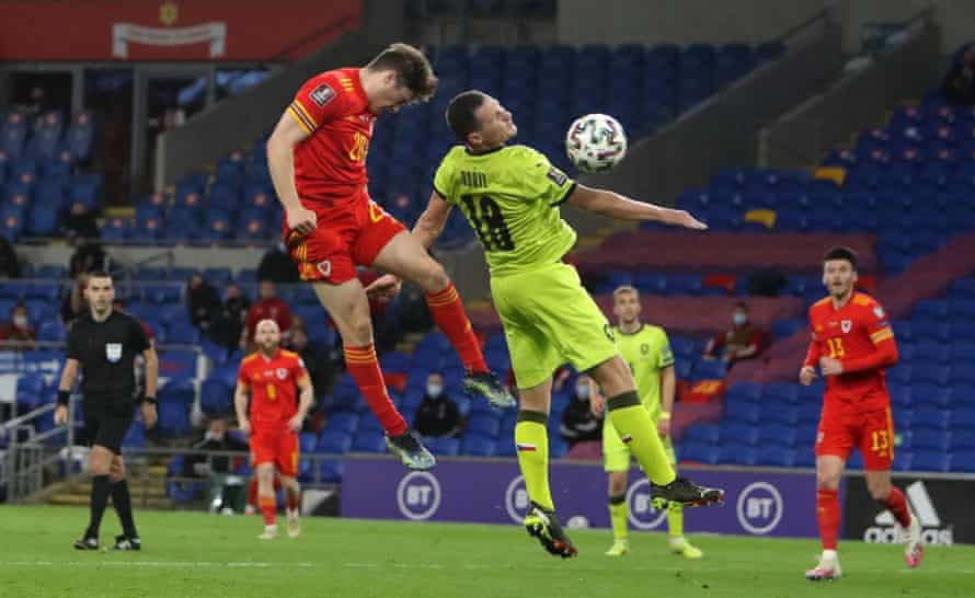 Wales’ Daniel James rises highest and heads home the only goal of the game.
